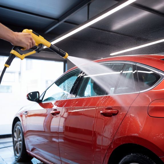 Photo of Man Cleaning His Car