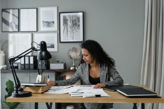 Businesswoman evaluates documents