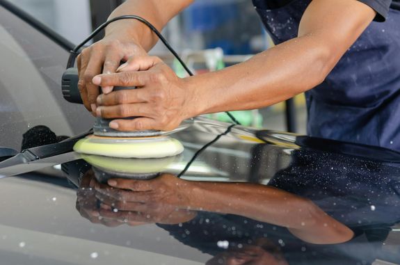 A Person Buffing a Car