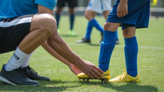 Person Kicking a Soccer Ball
