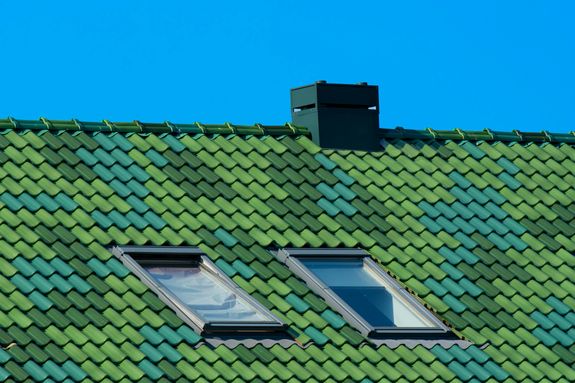 Green Tiles on the Roof of a House 