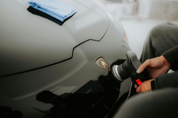 A Person Polishing the Car's Body