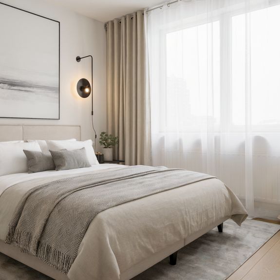 Spacious bedroom interior in pastel colors