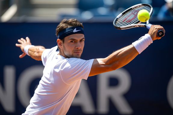 Man Playing Tennis on the Court Outdoors 