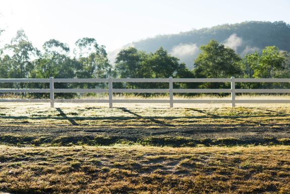 Wooden Fence in Green Field Photo