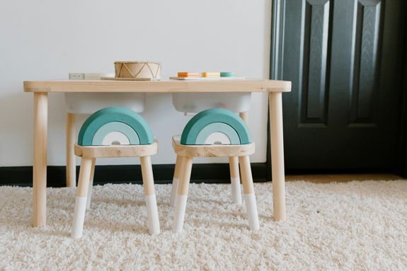 Bright playroom featuring wooden furniture and educational toys for children. Ideal for sustainable learning.