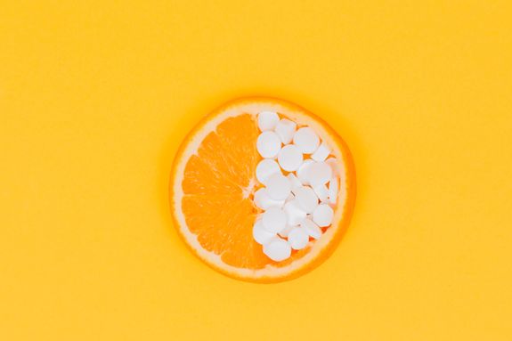 orange fruit slices on yellow surface