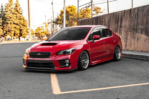 Red Subaru Sedan on Road