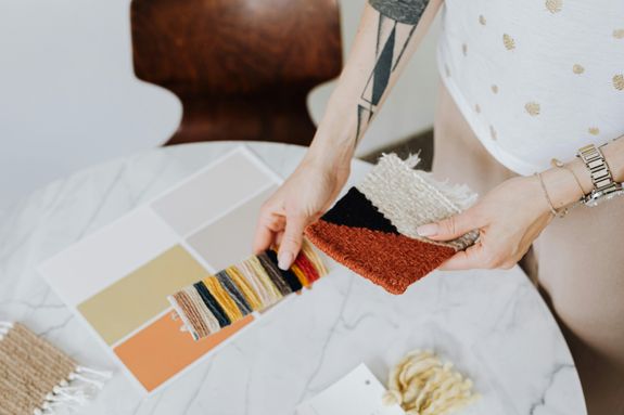 Woman Picking Materials and Paint from Samples 