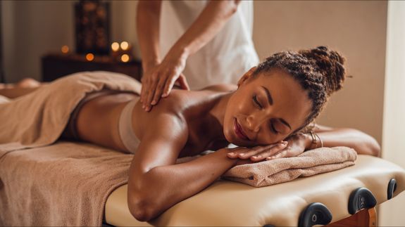 Woman Having a Massage with Massage Stones 