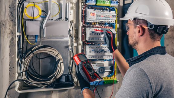 Electrician Repairing Electrical Post