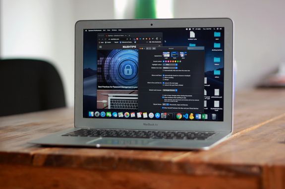 Macbook Air on Brown Wooden Table