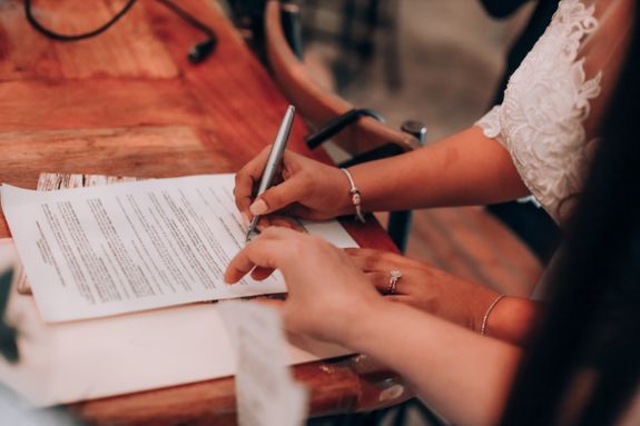 Women Signing Documents