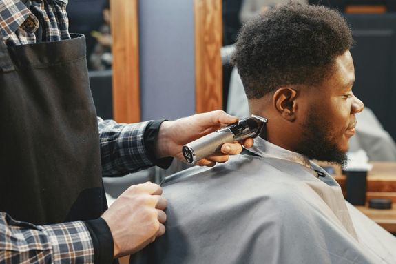 Photo of a Man Getting a Haircut