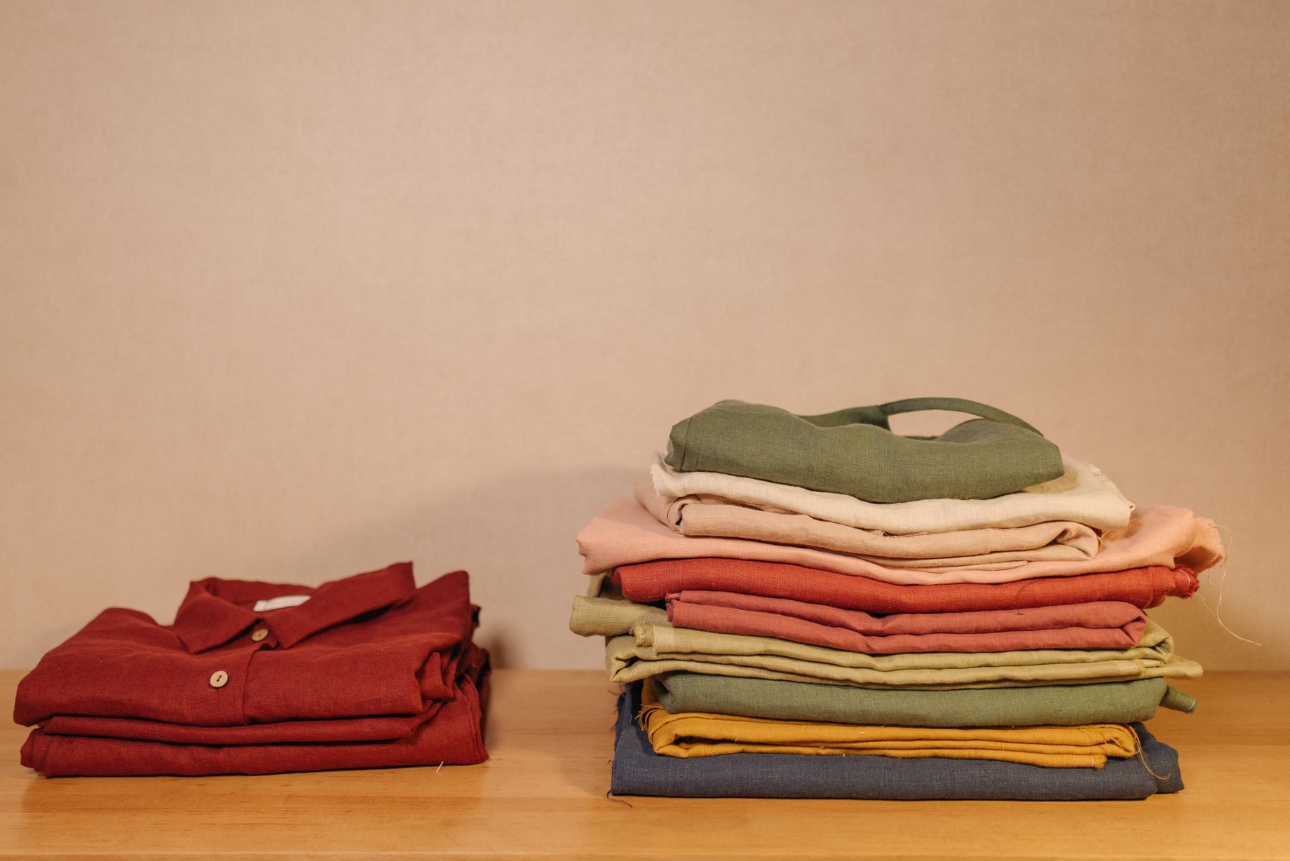 Folded Clothes on the Wooden Table