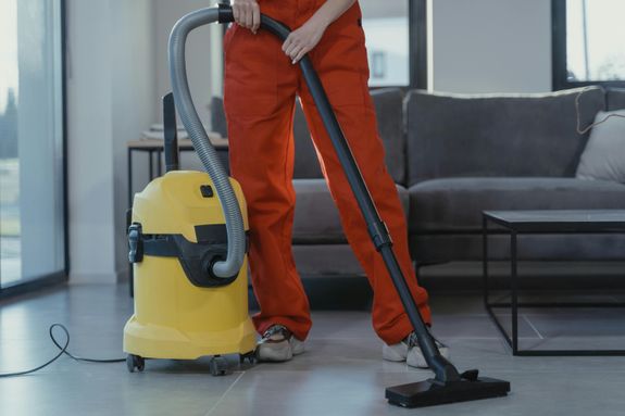 Person Using a Vacuum 