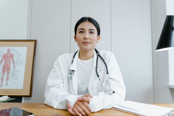 A Woman in White Lab Gown