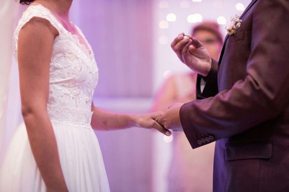 Person Holding Ring While Holding Woman's Hand Using Left Hand