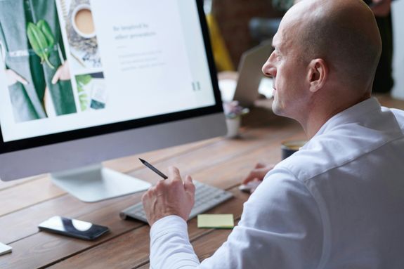 Photo Of Man Using Computer