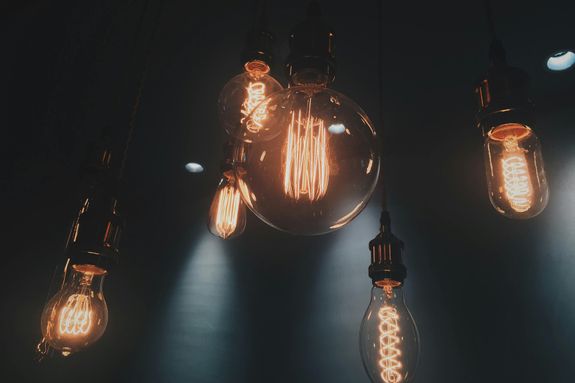 Close-up of vintage Edison light bulbs glowing warmly in Shinjuku, Tokyo.