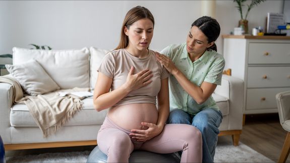 Person Holding Baby's Feet