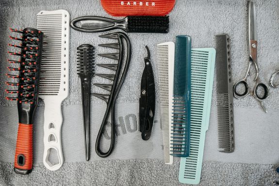 Plastic Combs on the Gray Towel