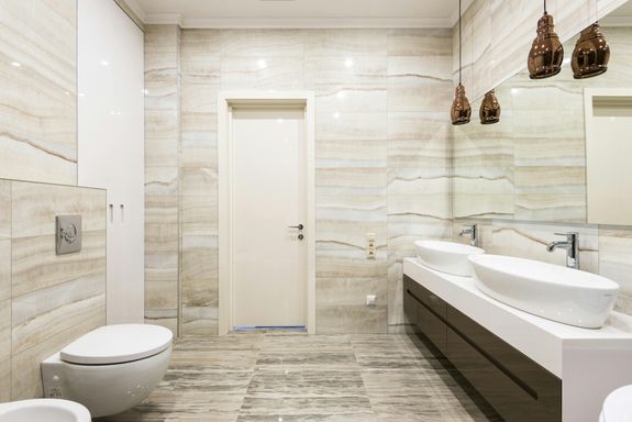 Beige Bathroom with Sinks and Toilet