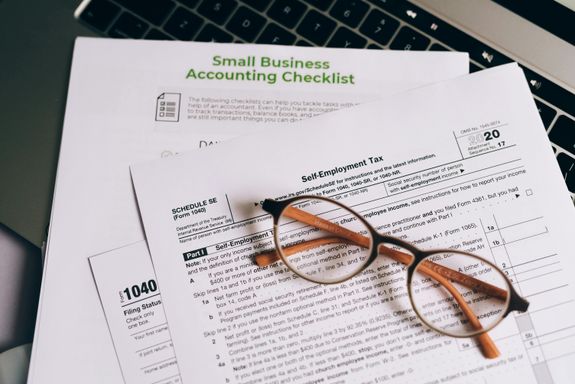 An Eyeglasses on Top of the Documents