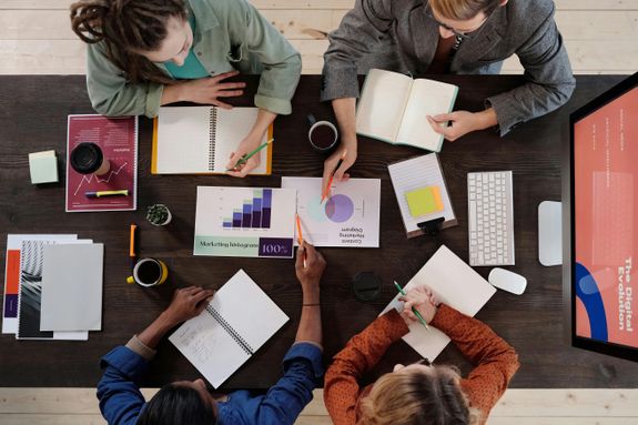 A Group of People Having a Meeting in the Office