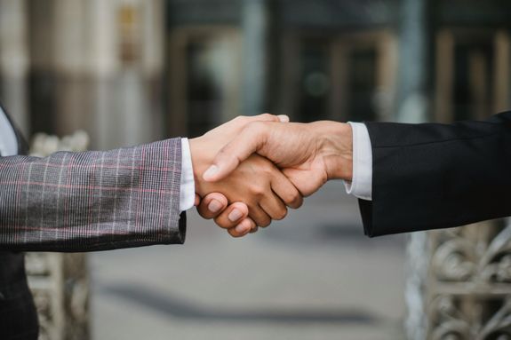 Two People Shaking Hands 