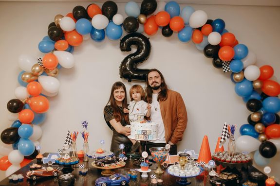 Family Among Birthday Decorations