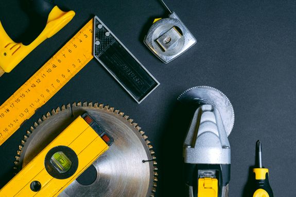 Yellow and Black Hand Tools on the Table