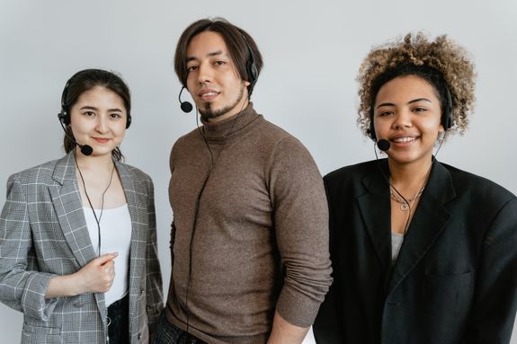 Photograph of Coworkers with Black Headsets