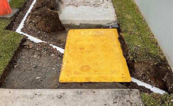 Exterior drain installed after sidewalk removal