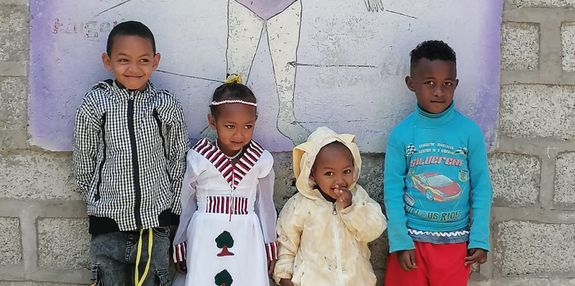 Four children outside Haro Denbel School