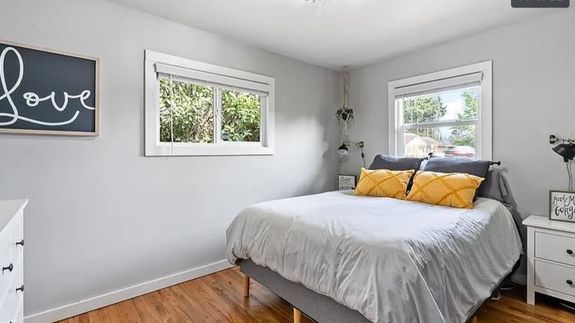 Oval Mirror Near Toilet Bowl