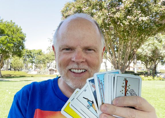Kevin Coburn, Psychic Medium and Tarot Card Reader holding a deck of Tarot Cards
