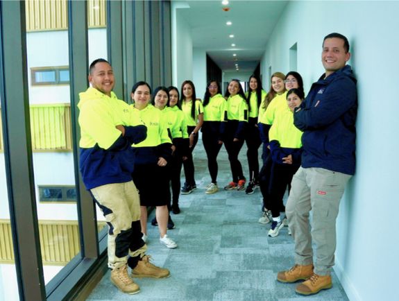 Crop housewife cleaning surface near sink
