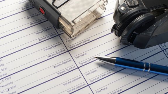 Crop businessman giving contract to woman to sign