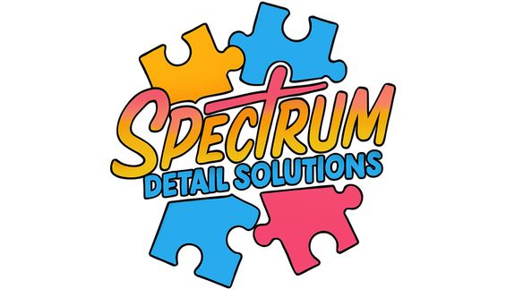 Sleek black luxury car parked in a modern, well-lit garage with a polished floor.