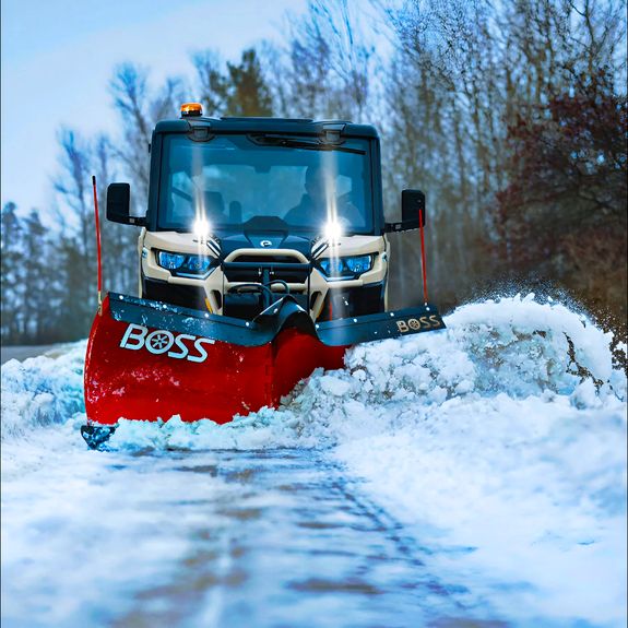 How do you determine when to service my property during a snowstorm?