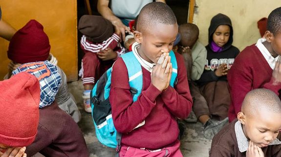 Detailed image of a camera lens aperture showing mechanical blades.