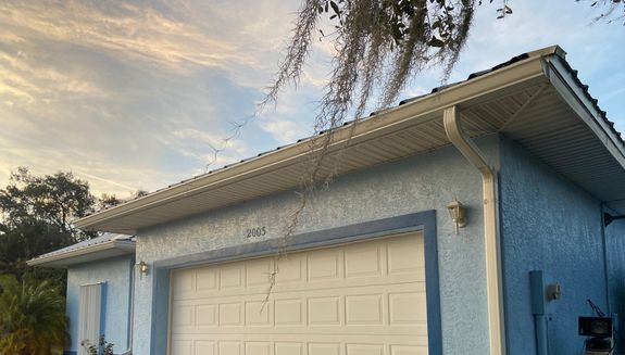 Blue house with La Belle gutters installed by GSF