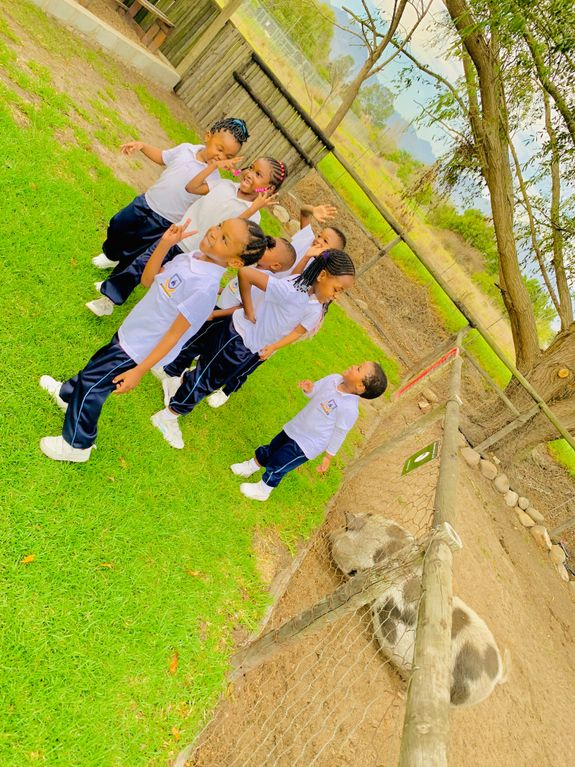 Girl in Red Dress Playing Blocks