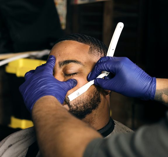 Experience Exceptional Grooming and Artistic Expression at 2 Kool Barber Tattoo & Piercings in Discovery Bay, Jamaica