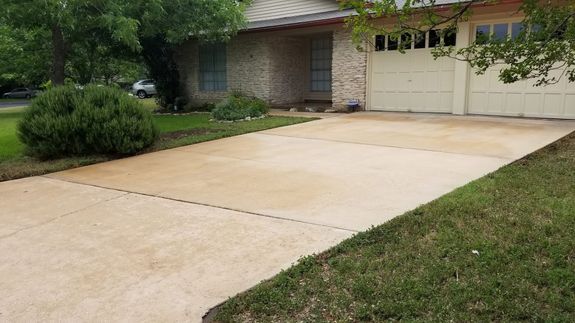 How does pressure washing improve my driveway's appearance?